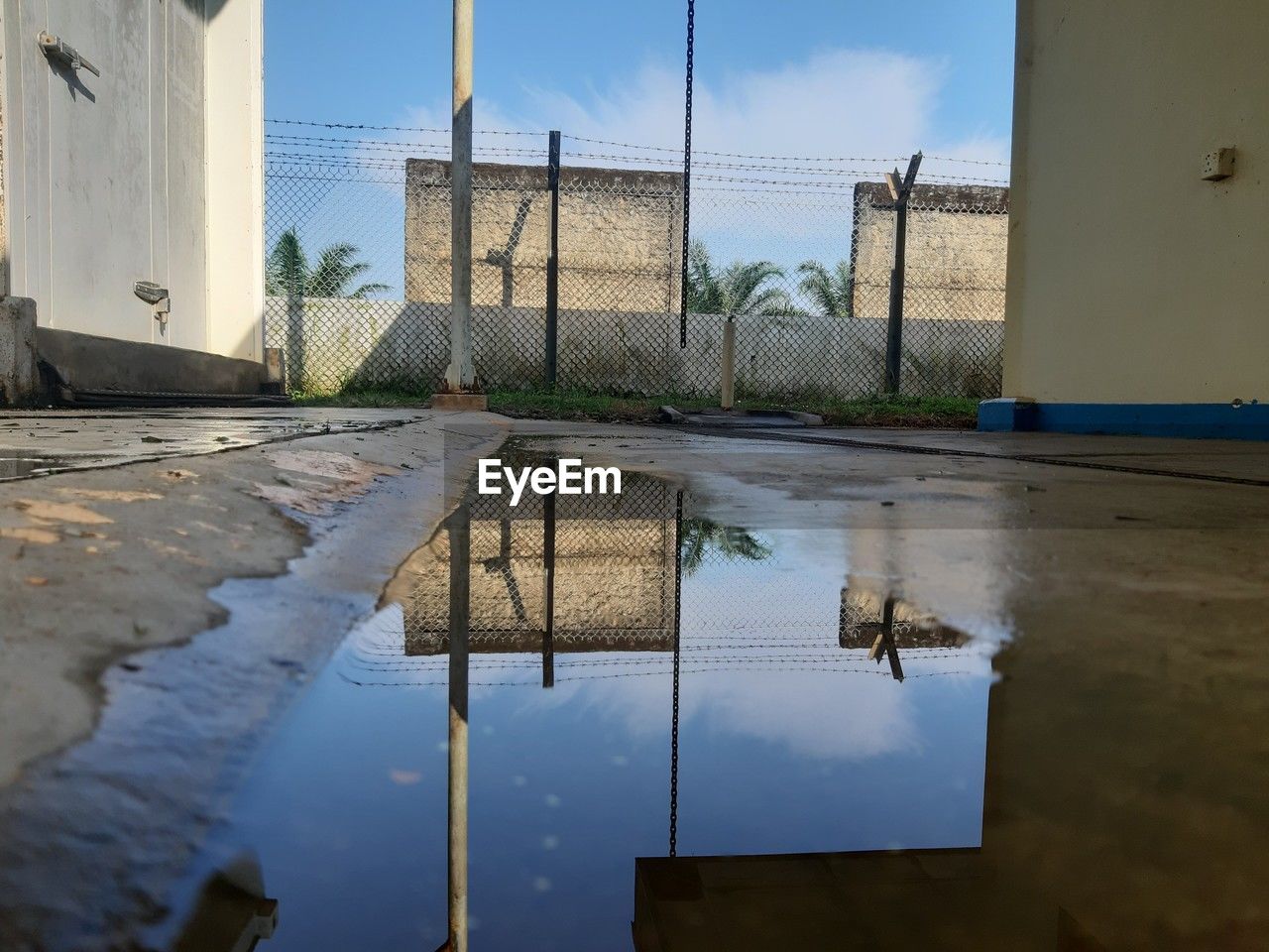 reflection, water, architecture, urban area, sky, puddle, built structure, nature, building exterior, building, no people, day, wall, outdoors, city, flood, wet