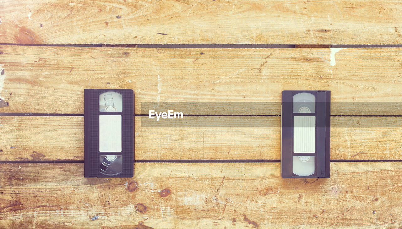 Directly above shot of audio cassettes on wooden table