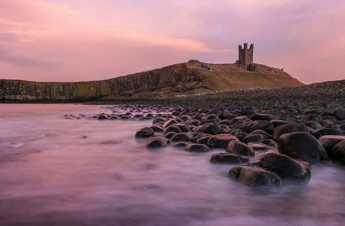 VIEW OF RIVER AT SUNSET