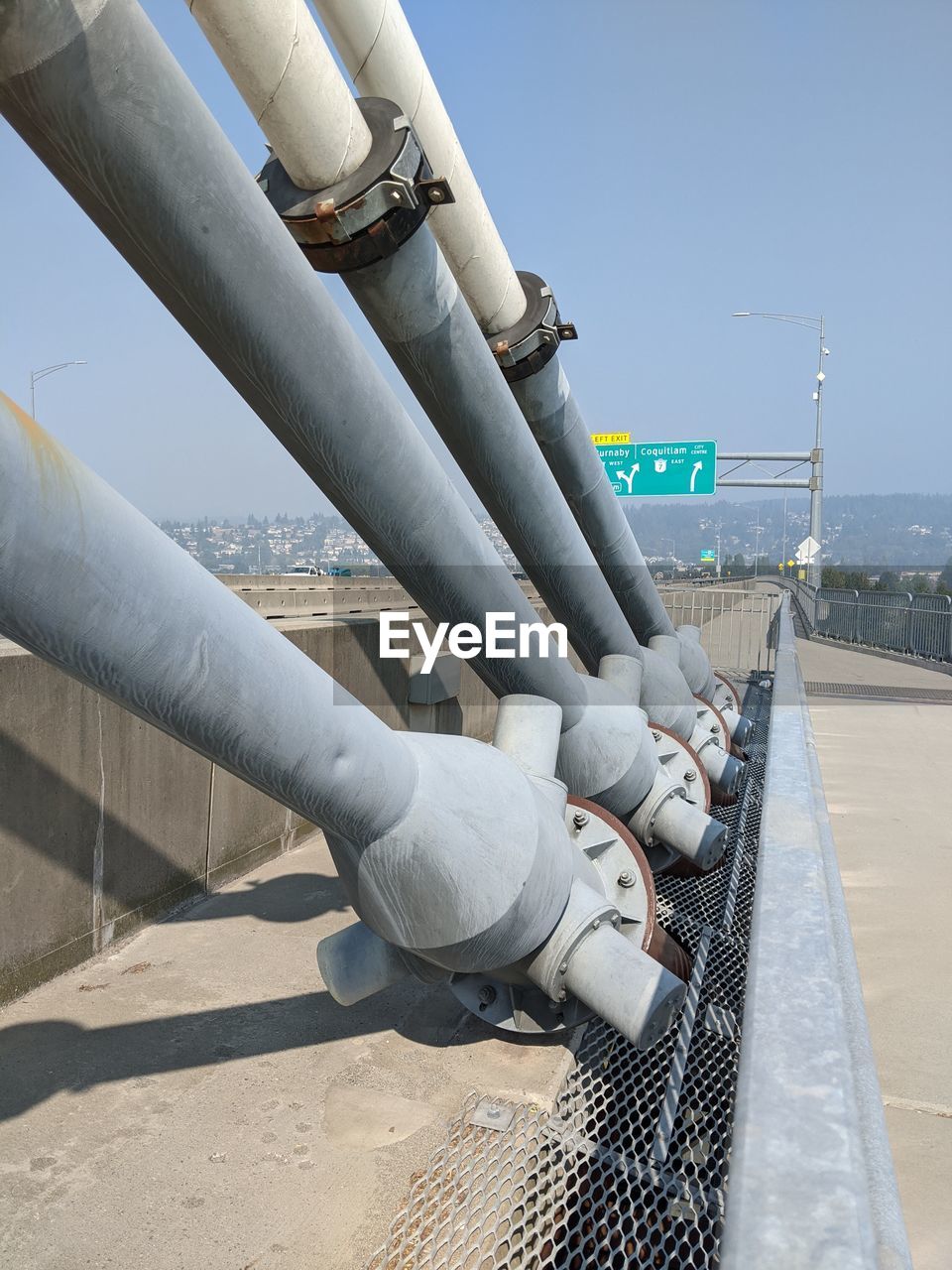 LOW ANGLE VIEW OF INDUSTRY AGAINST CLEAR SKY