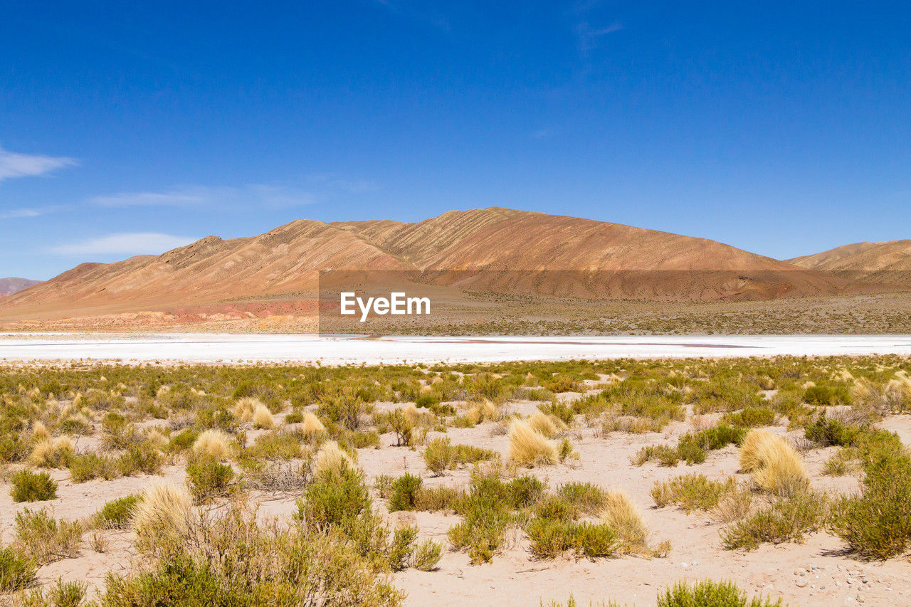 scenic view of mountains against clear blue sky