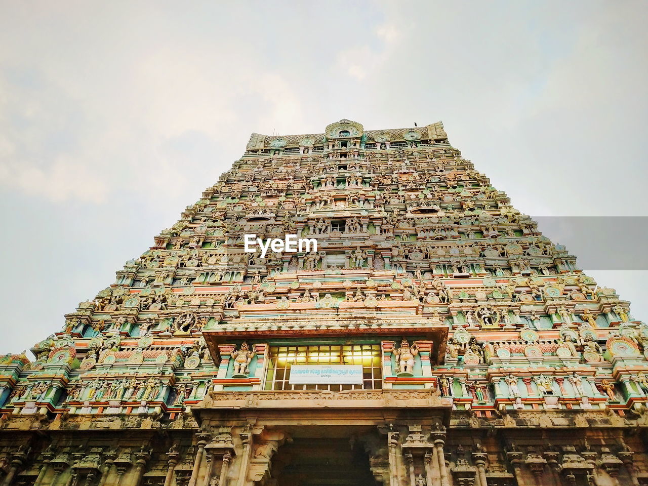 LOW ANGLE VIEW OF TEMPLE AGAINST BUILDING