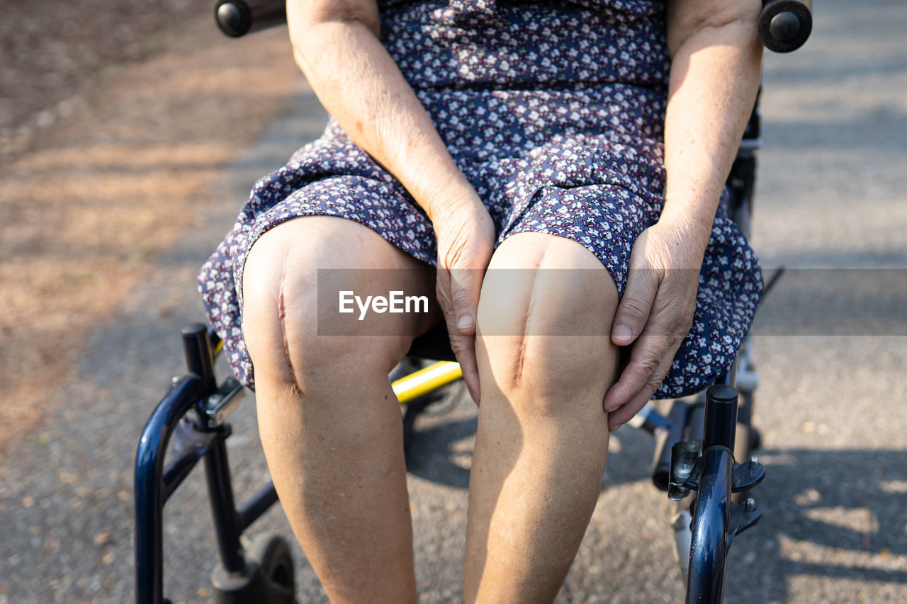 LOW SECTION OF PERSON RIDING BICYCLE