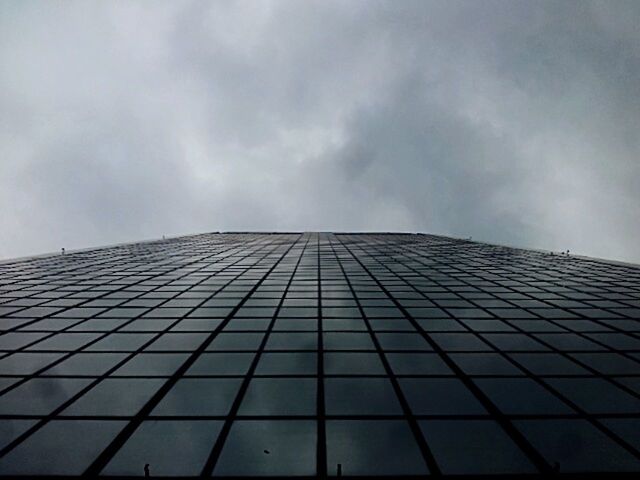 LOW ANGLE VIEW OF MODERN BUILDING AGAINST SKY