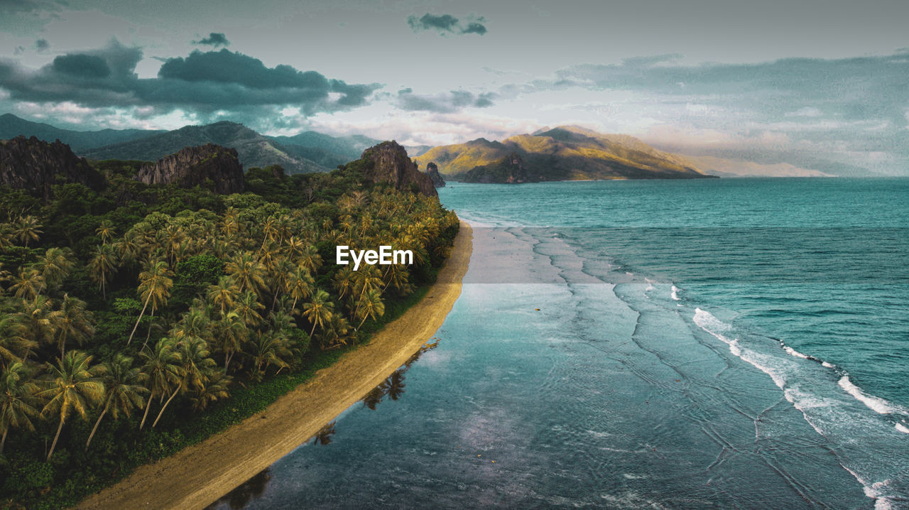 Scenic view of sea against cloudy sky