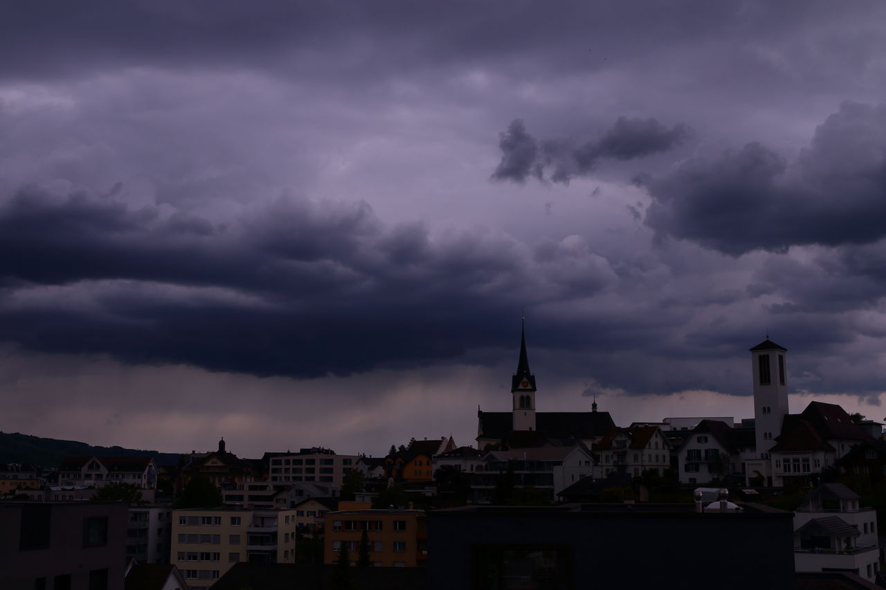 STORM CLOUDS OVER CITY