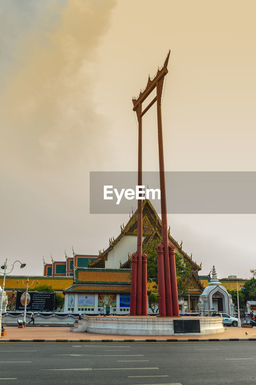 LOW ANGLE VIEW OF CRANES AT CONSTRUCTION SITE AGAINST SKY