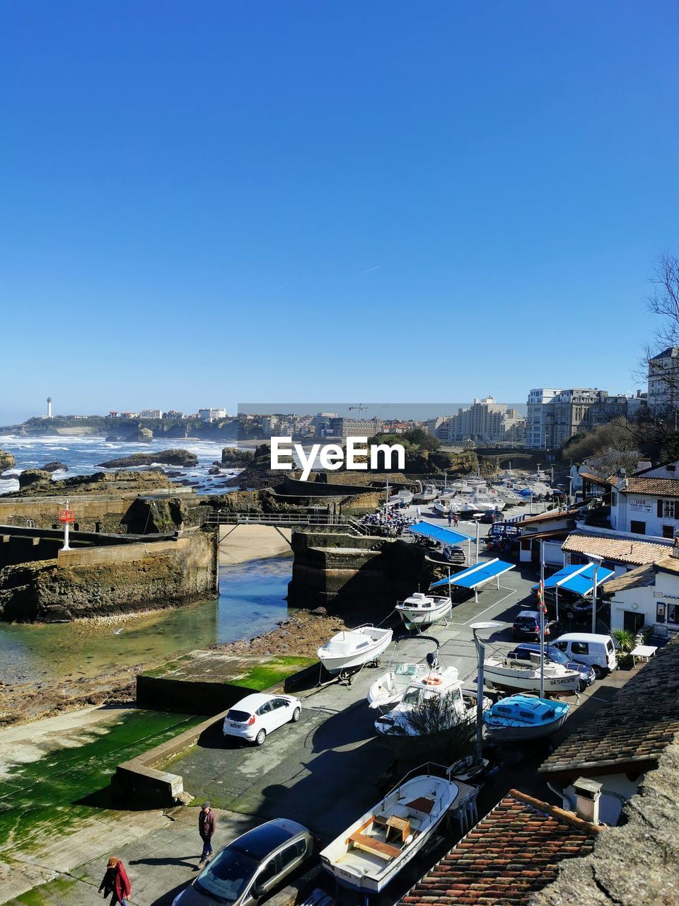 High angle view of city against clear blue sky