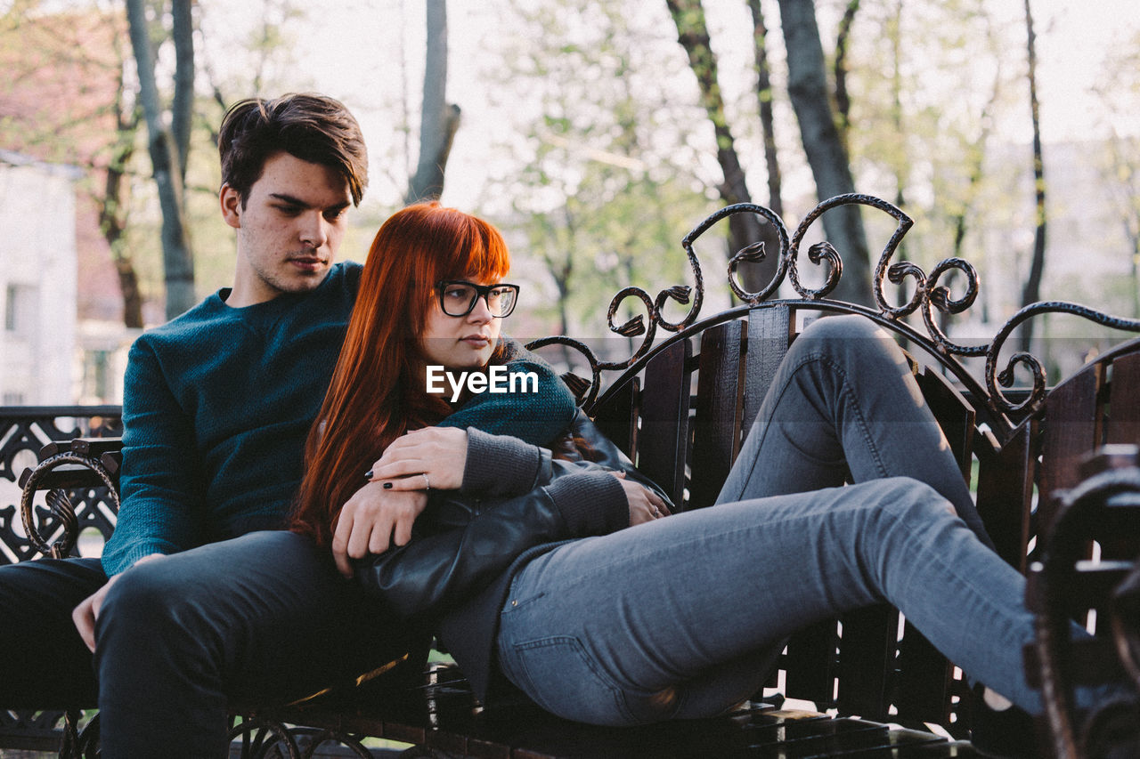 Young couple sitting on bench