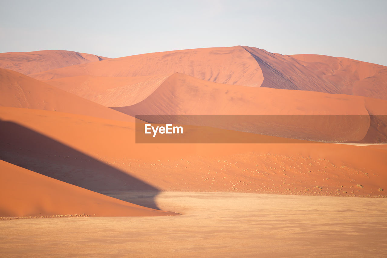 Scenic view of desert against clear sky