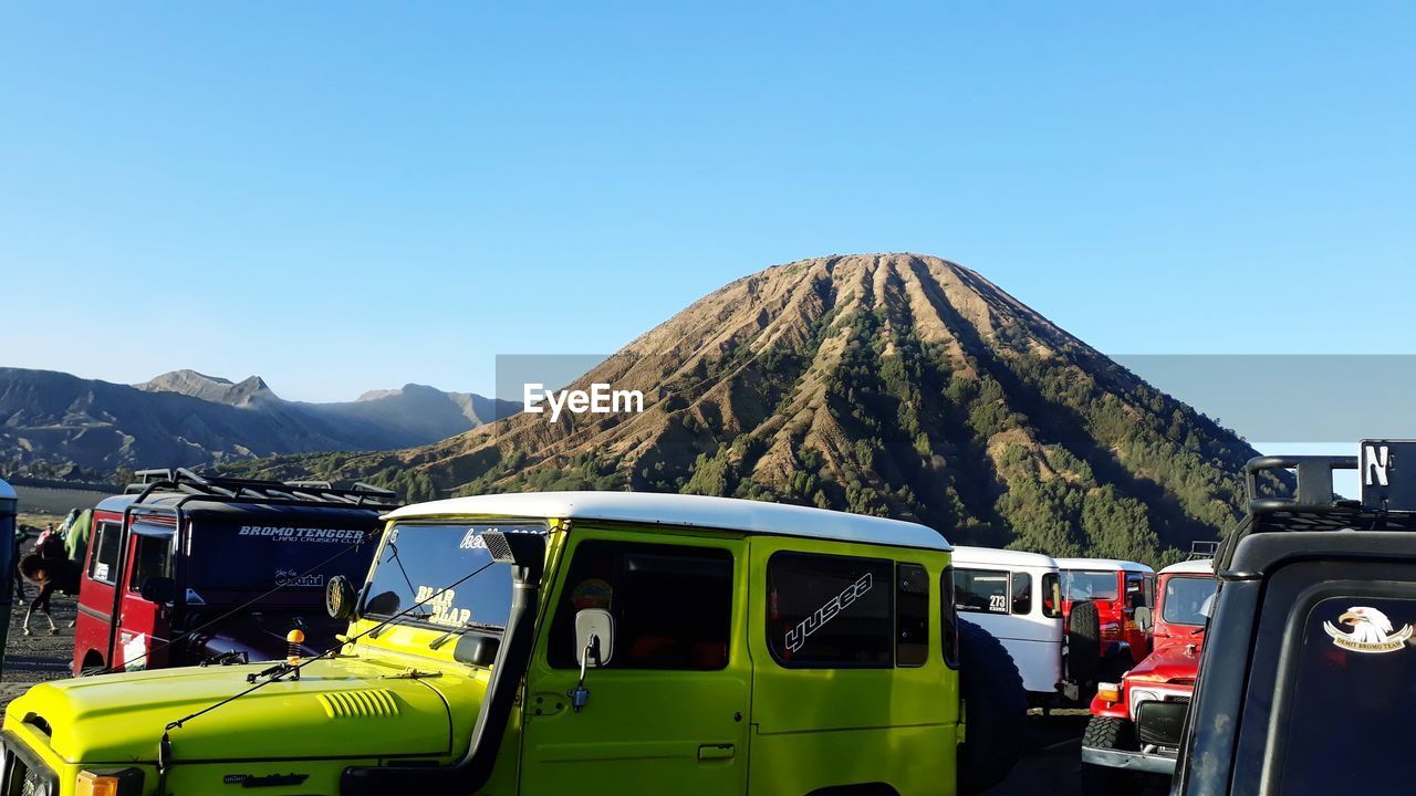 Panoramic view of mountains against clear blue sky