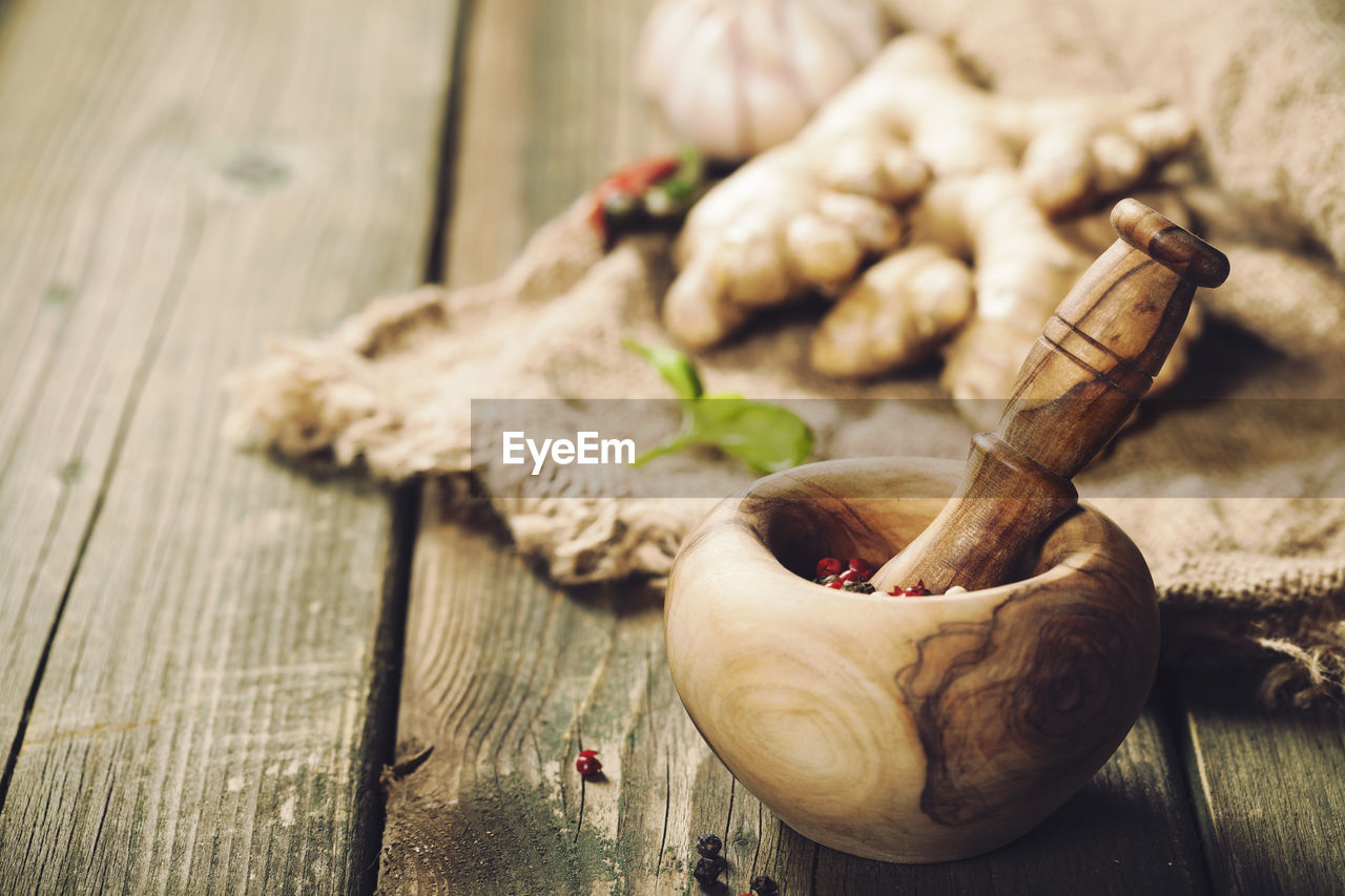 close-up of mortar and pestle on table