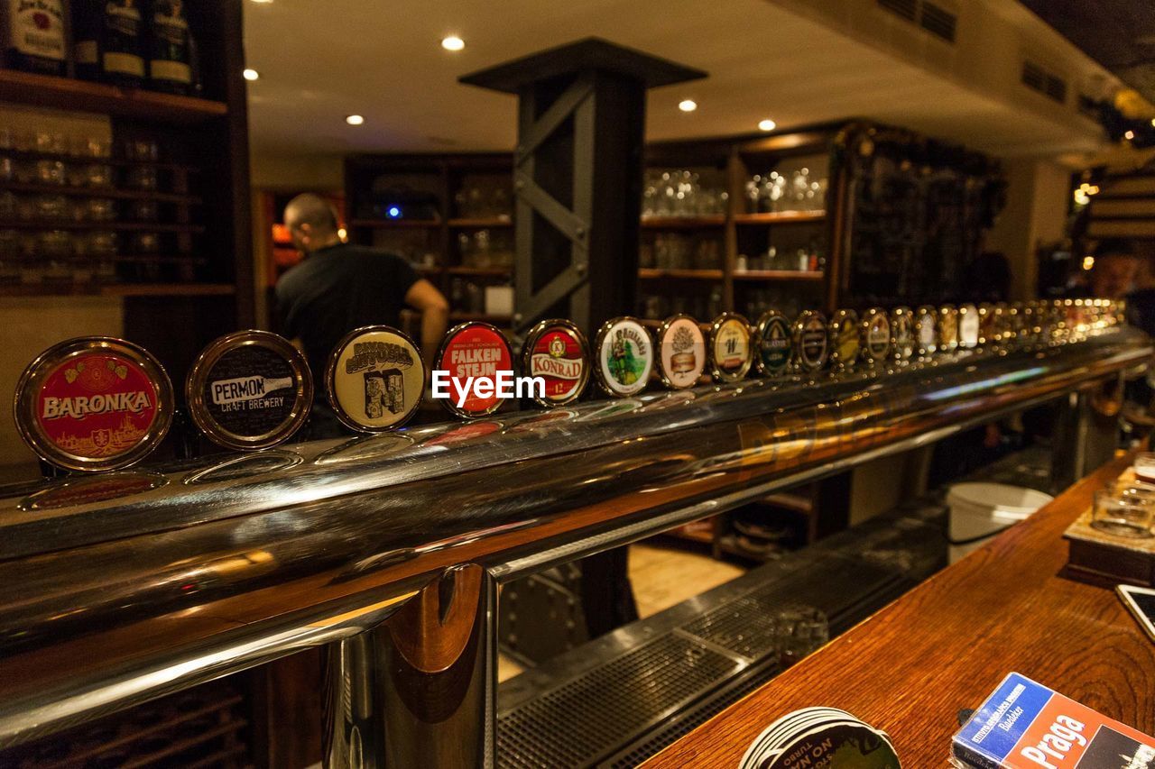 ILLUMINATED LIGHTS ON BAR COUNTER IN KITCHEN