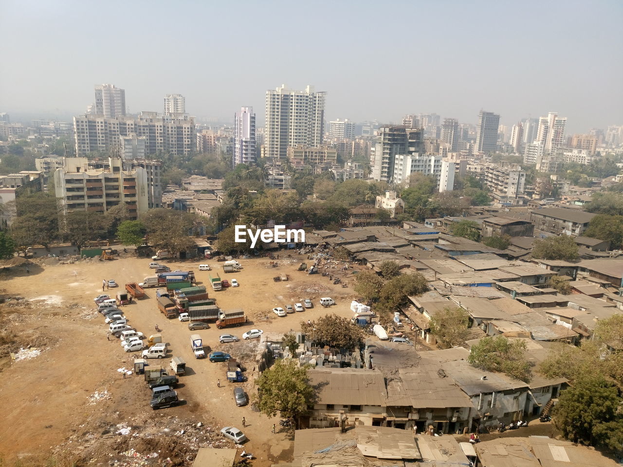 High angle view of slums in city against sky