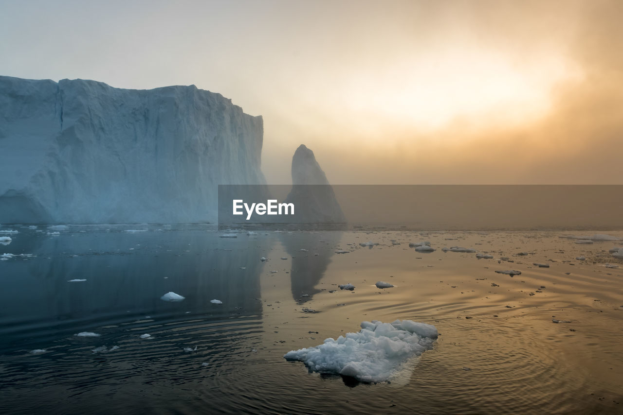 Scenic view of sea against sky at sunset