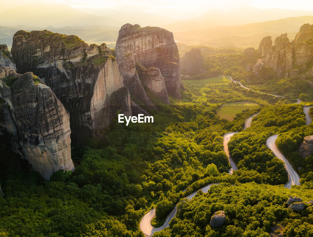 Meteora, greece, sandstone formations, sunset monasteries. travel destination. panoramic view