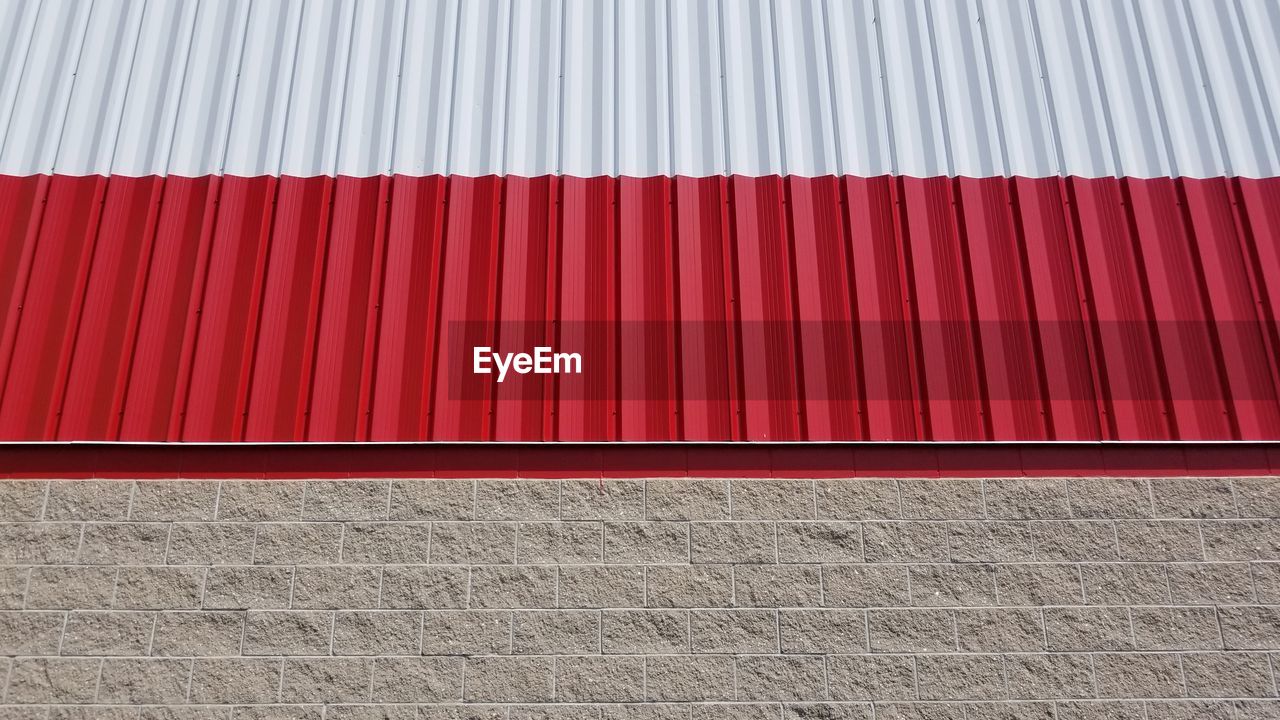 FULL FRAME SHOT OF RED WALL OF BUILDING