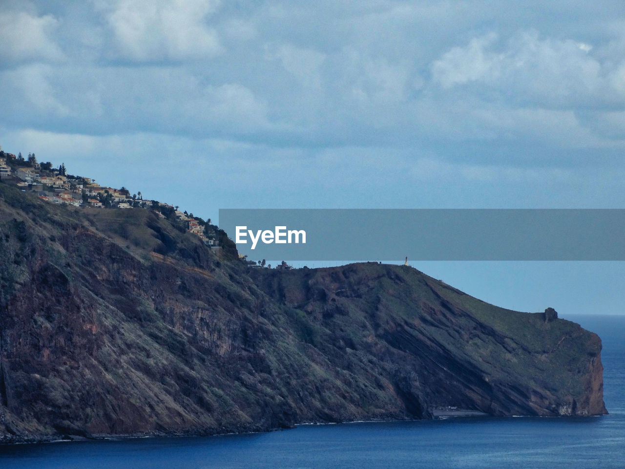 SCENIC VIEW OF SEA AND MOUNTAINS