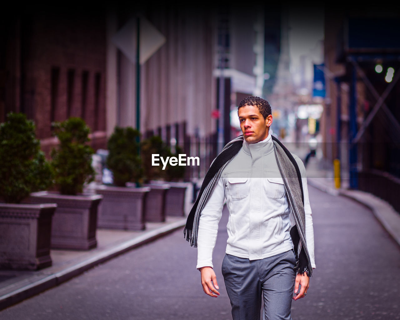 Portrait of young man walking on street in new york city in winter