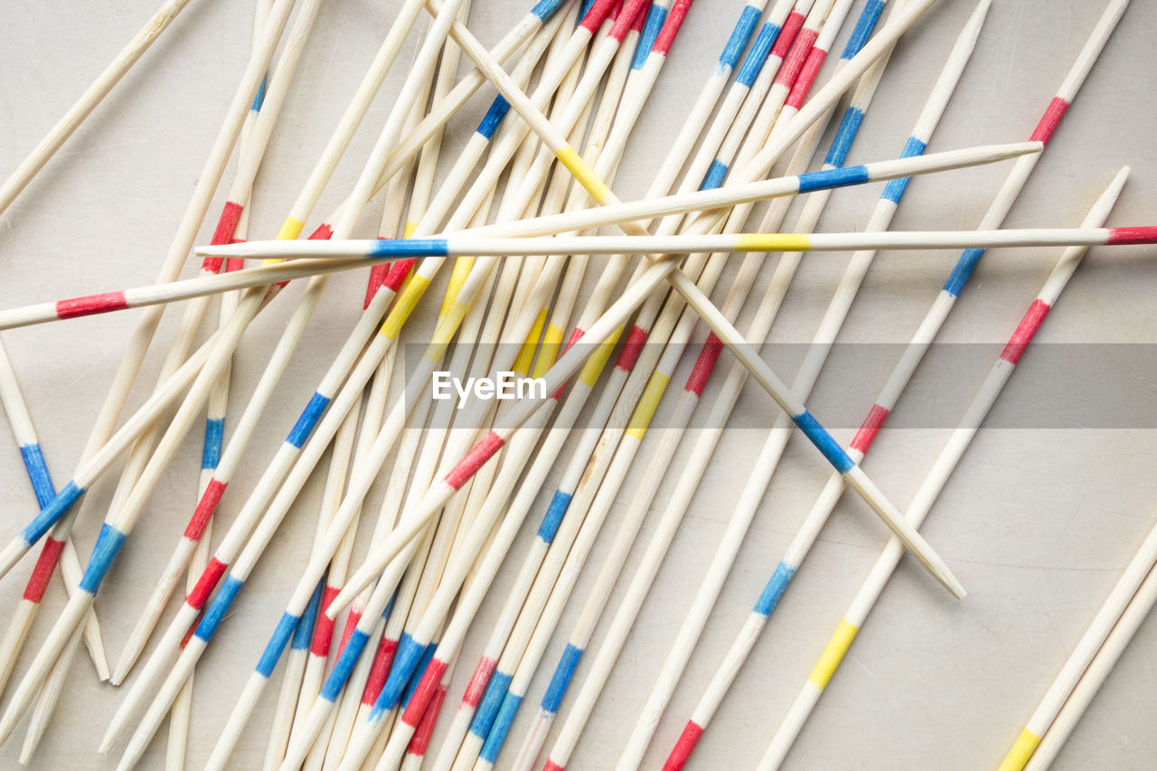 Close-up of colorful chopsticks on white background
