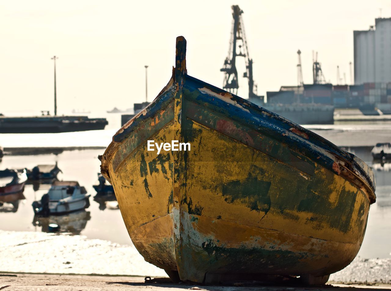 View of boats moored at beach against clear sky
