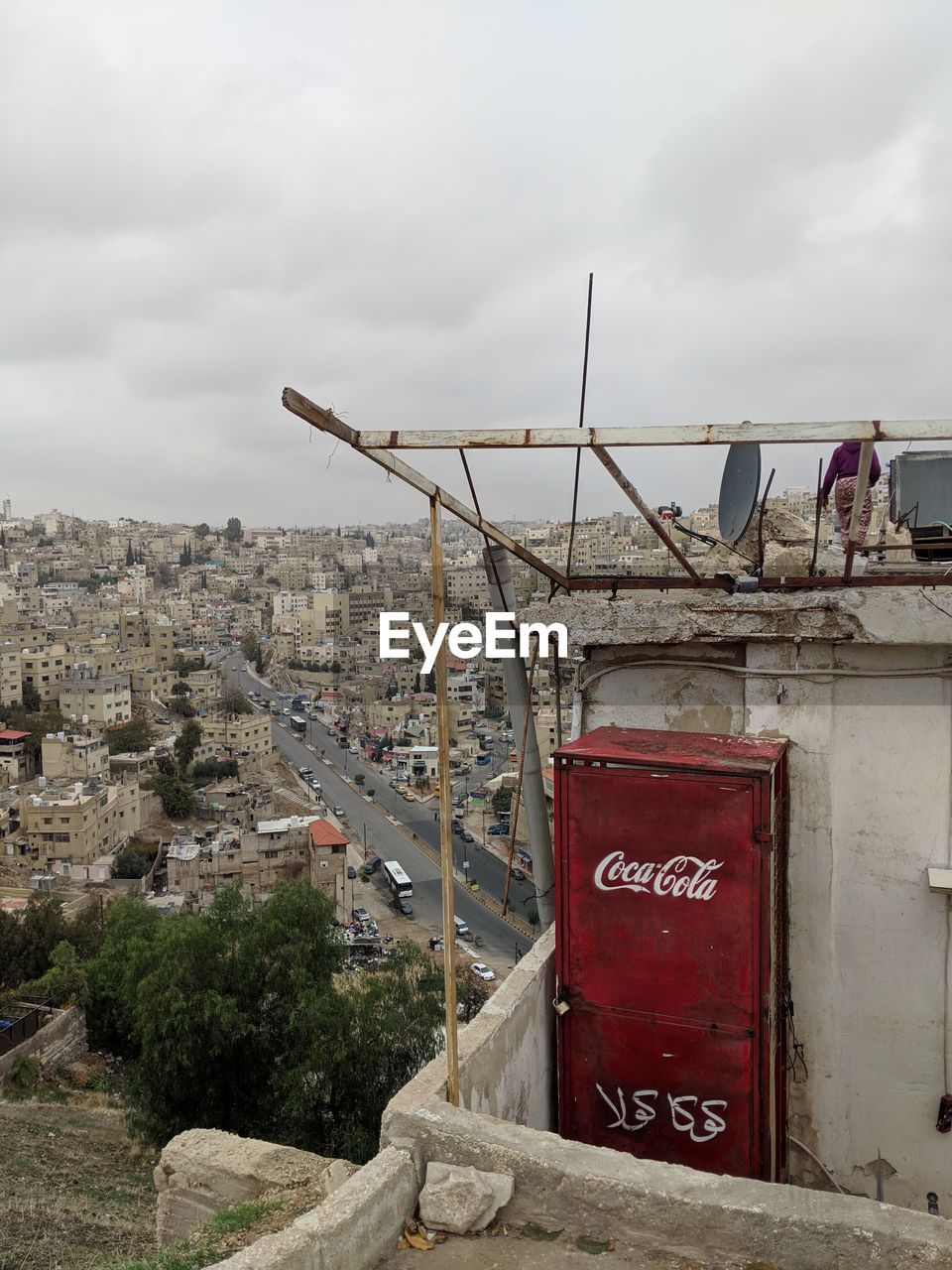 architecture, cloud, sky, built structure, communication, nature, building exterior, urban area, text, sign, city, no people, day, building, outdoors, wall, western script, overcast, transport, environment, industry