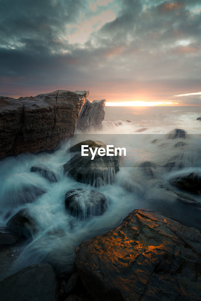 Scenic view of sea against sky during sunrise / sunset