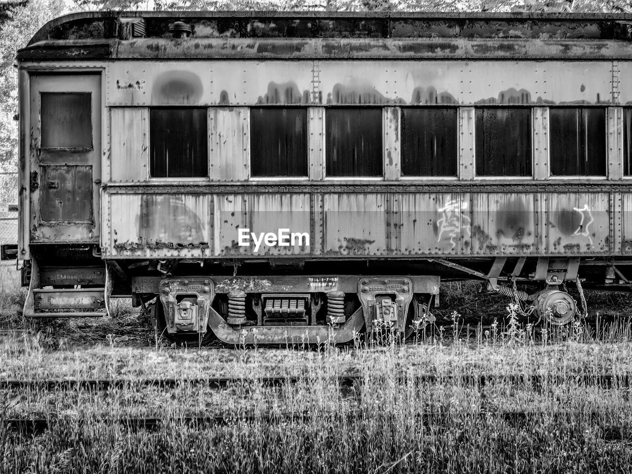 Side view of abandoned train on railroad track