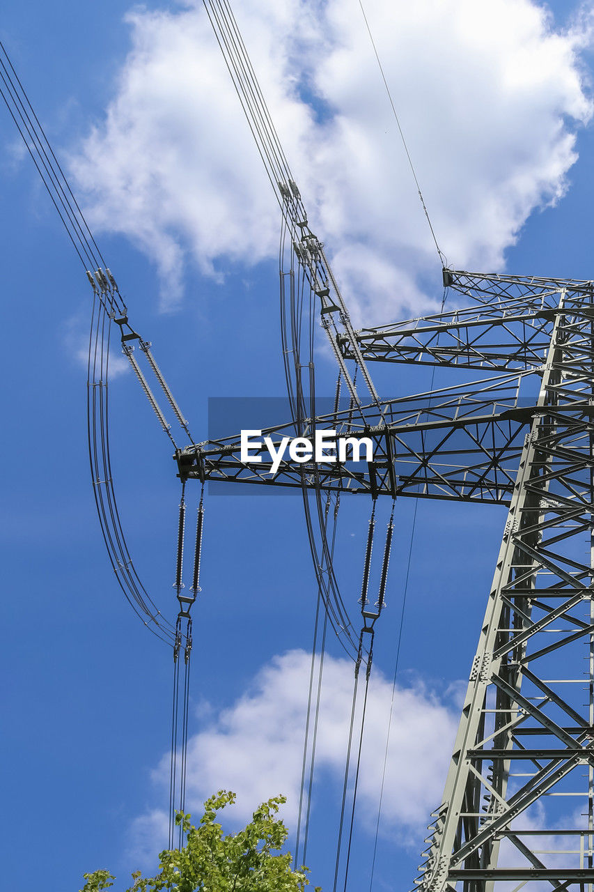 cloud, sky, electricity, overhead power line, cable, technology, transmission tower, tower, power supply, electricity pylon, power generation, nature, electrical supply, power line, no people, architecture, blue, mast, outdoor structure, built structure, outdoors, day, low angle view, industry, metal, line