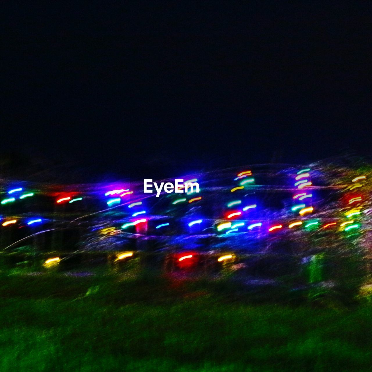 LIGHT TRAILS ON ILLUMINATED CITY