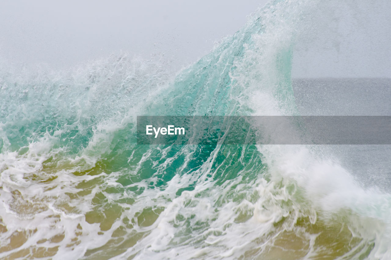 Close-up of sea waves on sunny day