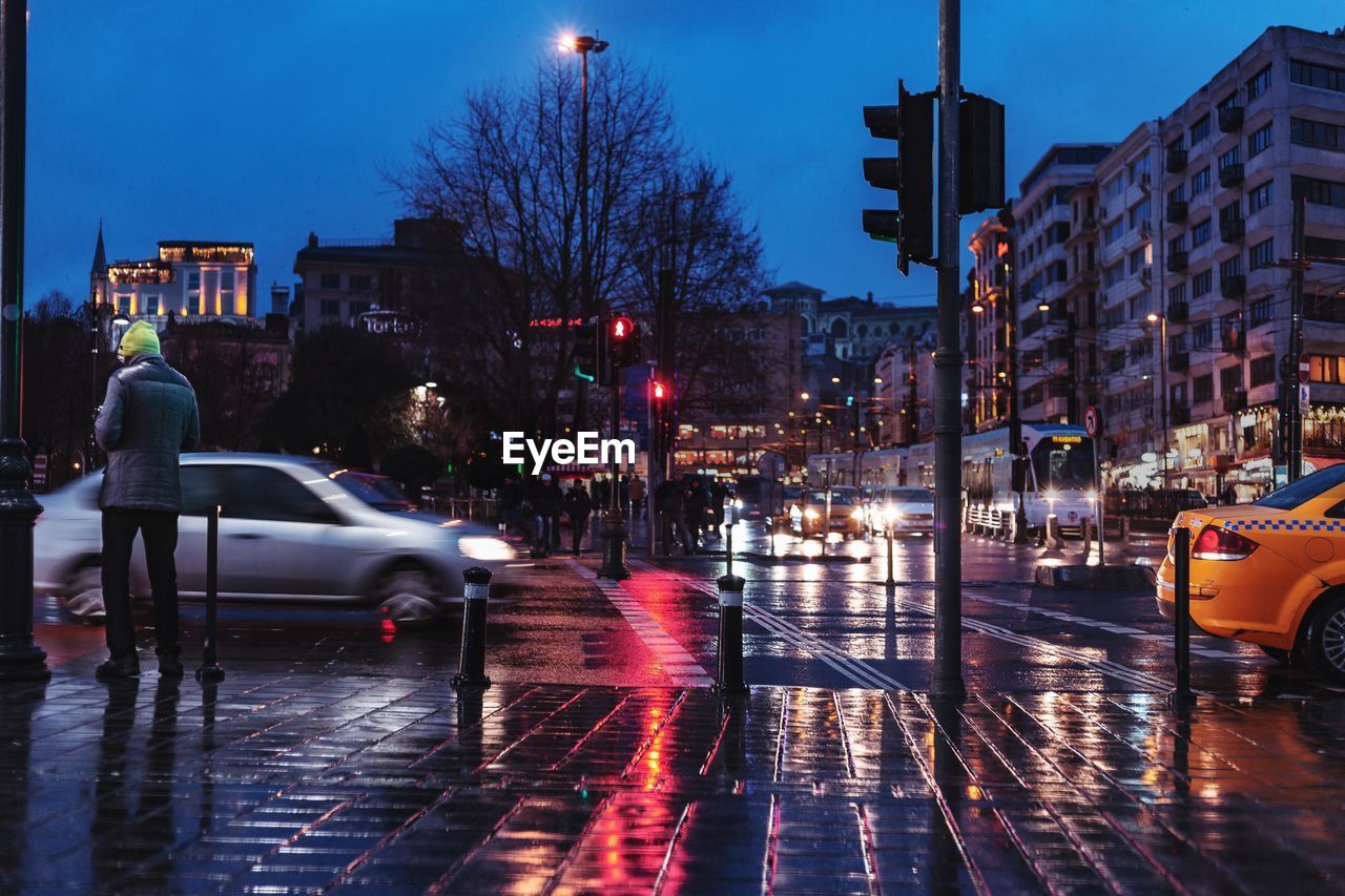 Wet city street during rainy season at night