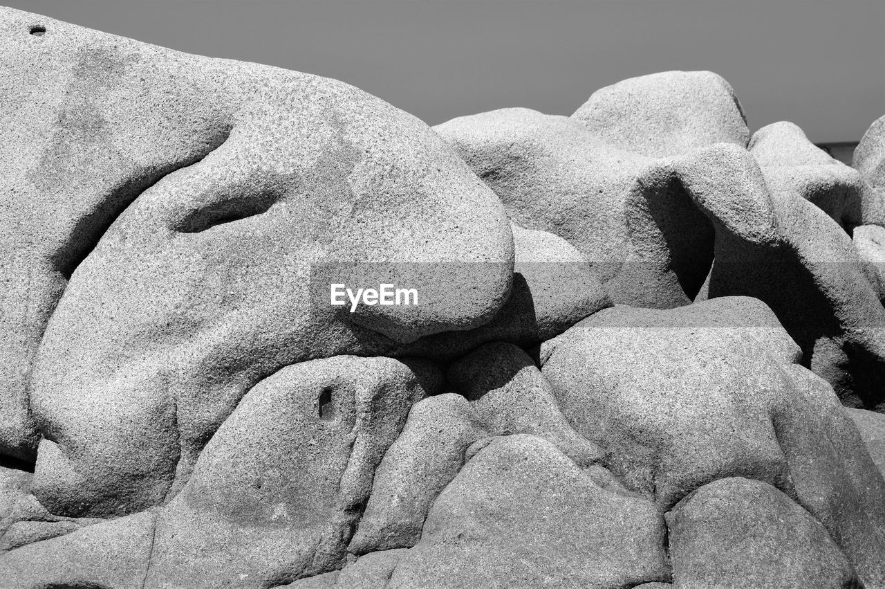 HIGH ANGLE VIEW OF SCULPTURE ON ROCK