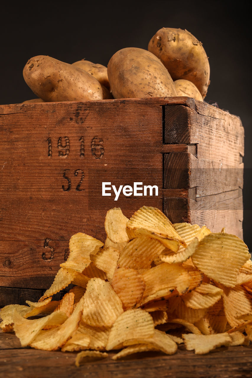 Close-up of potatoes  and chips on table