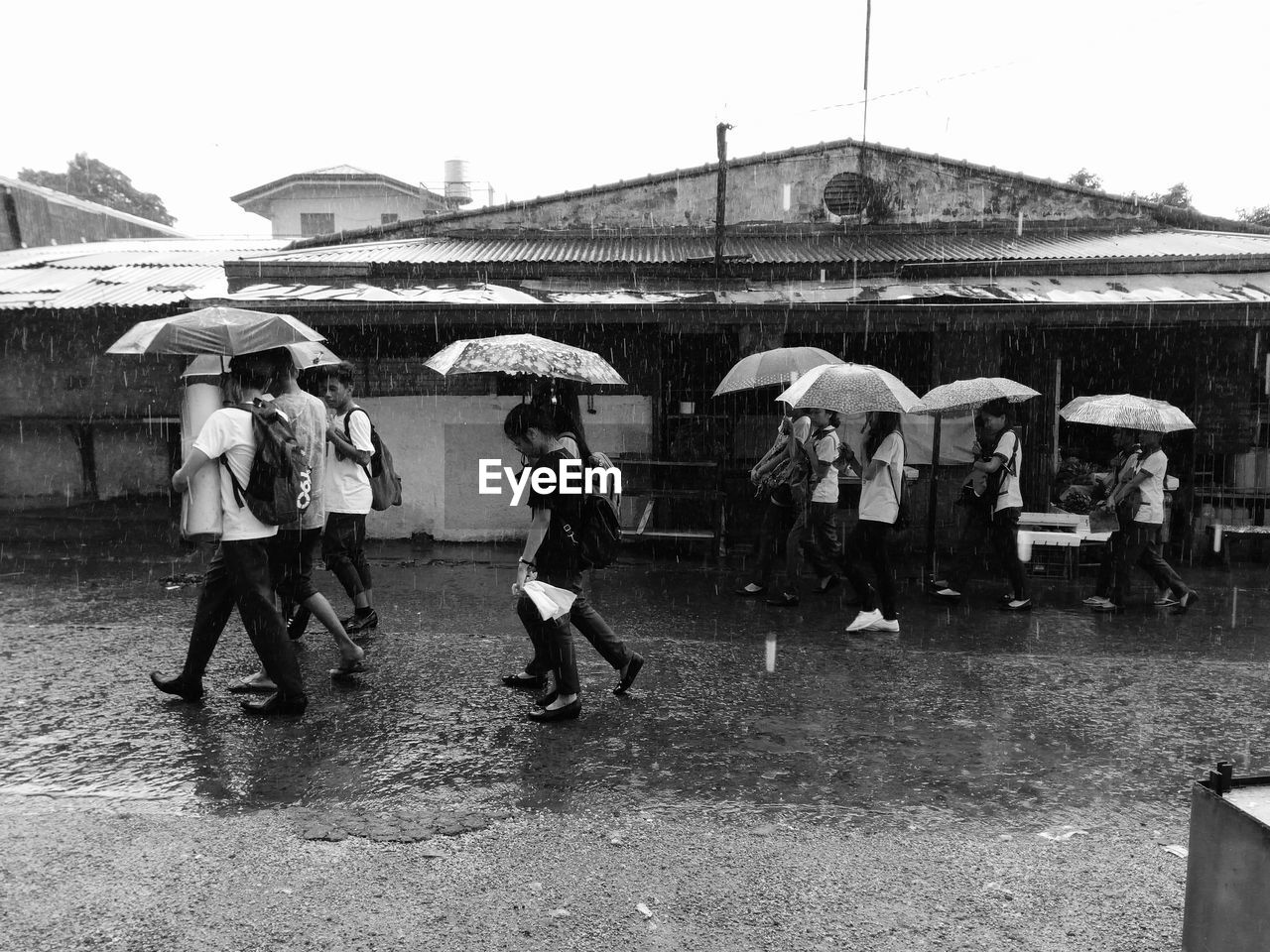 PEOPLE WALKING ON MARKET IN CITY