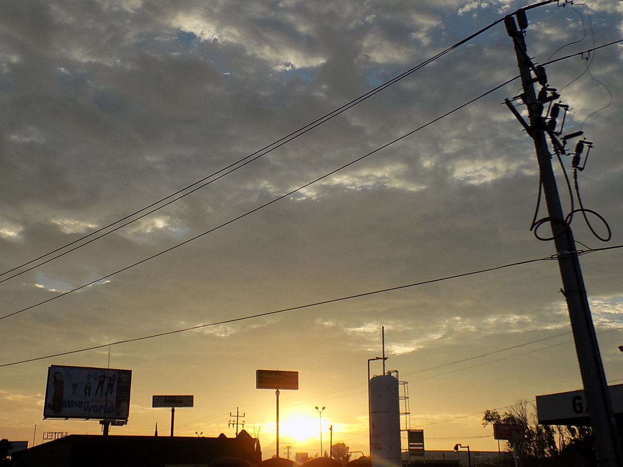 LOW ANGLE VIEW OF POWER LINES AGAINST SKY