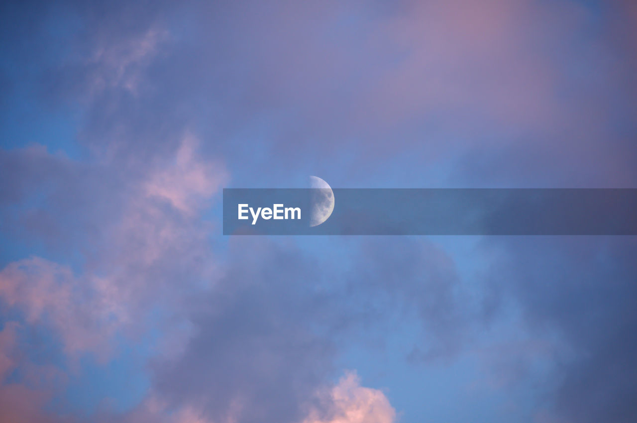 LOW ANGLE VIEW OF MOON AGAINST SKY