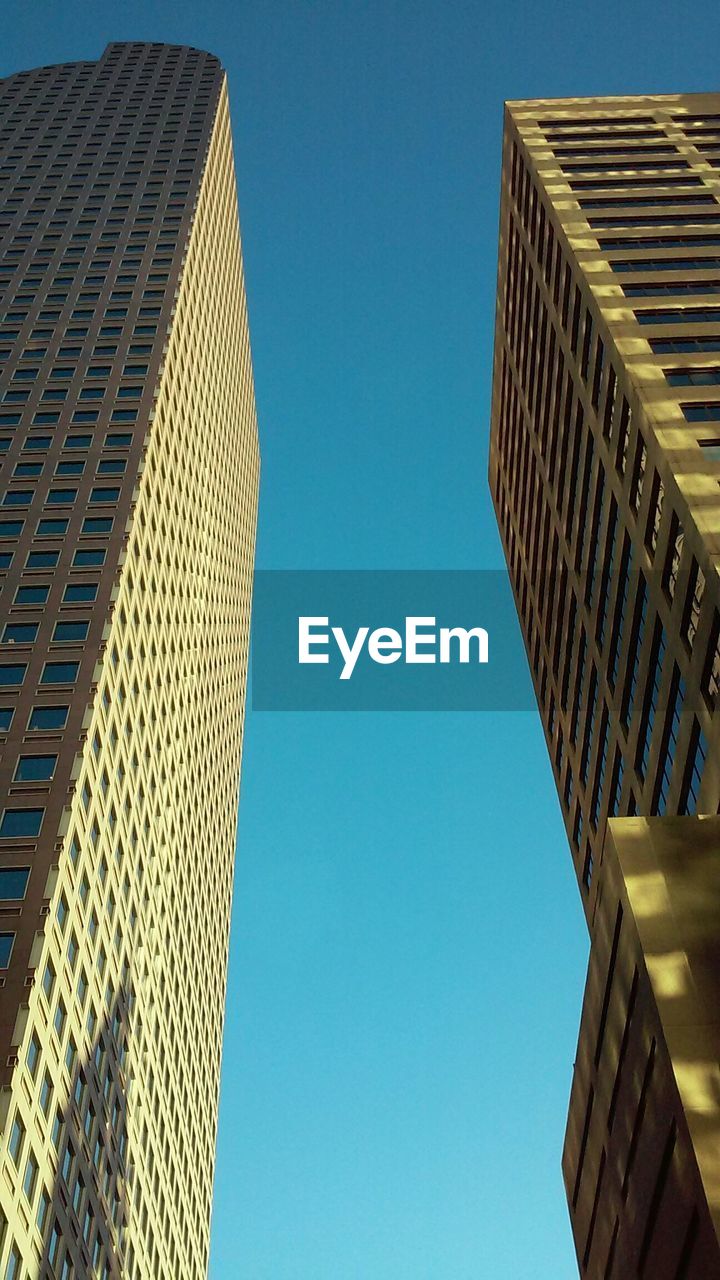 Low angle view of buildings against clear sky