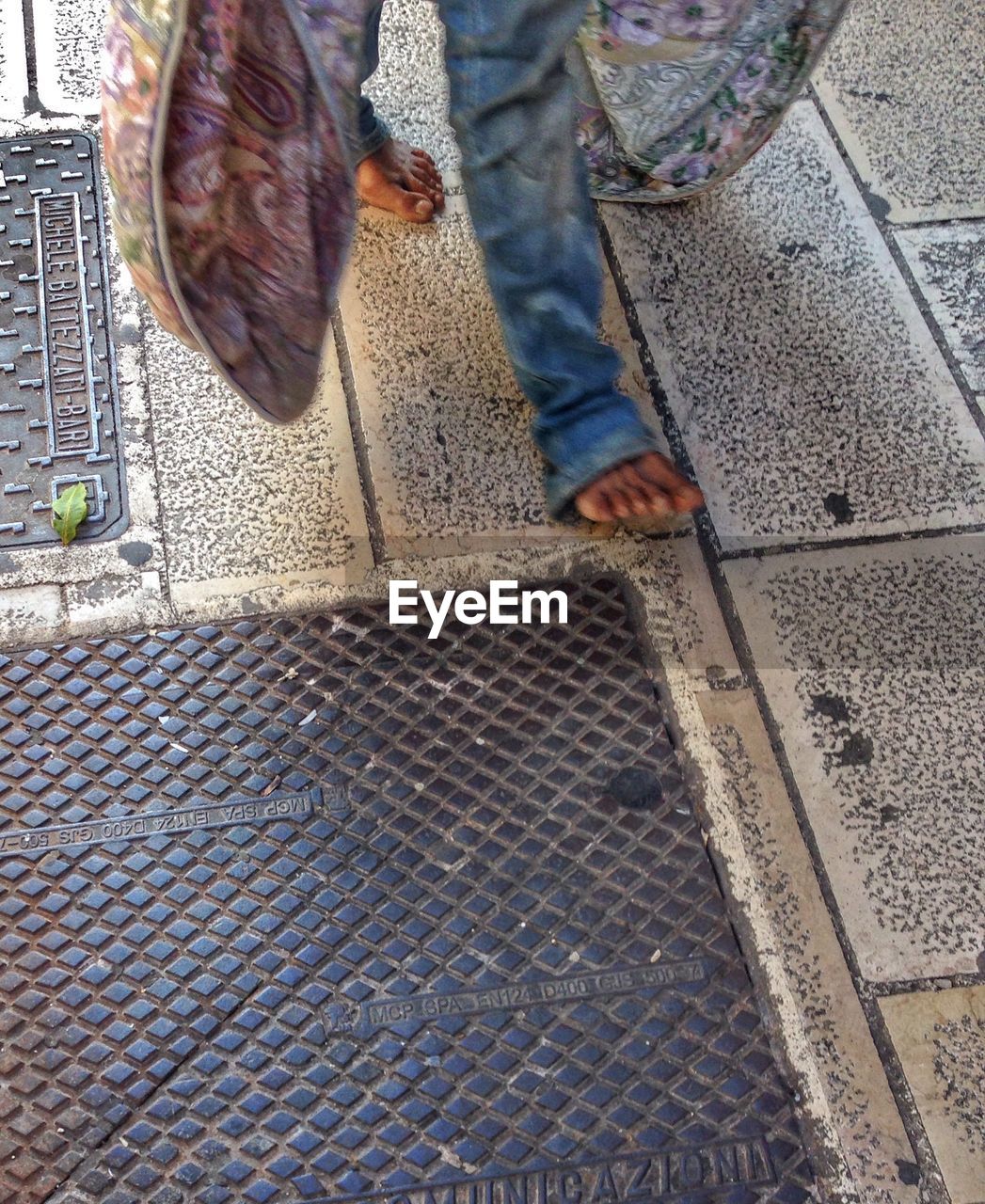 WOMAN STANDING ON FOOTPATH