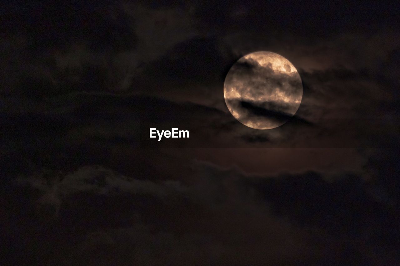 LOW ANGLE VIEW OF MOON AGAINST SKY