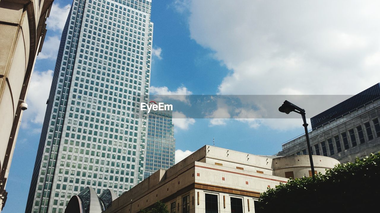 LOW ANGLE VIEW OF OFFICE BUILDING AGAINST SKY