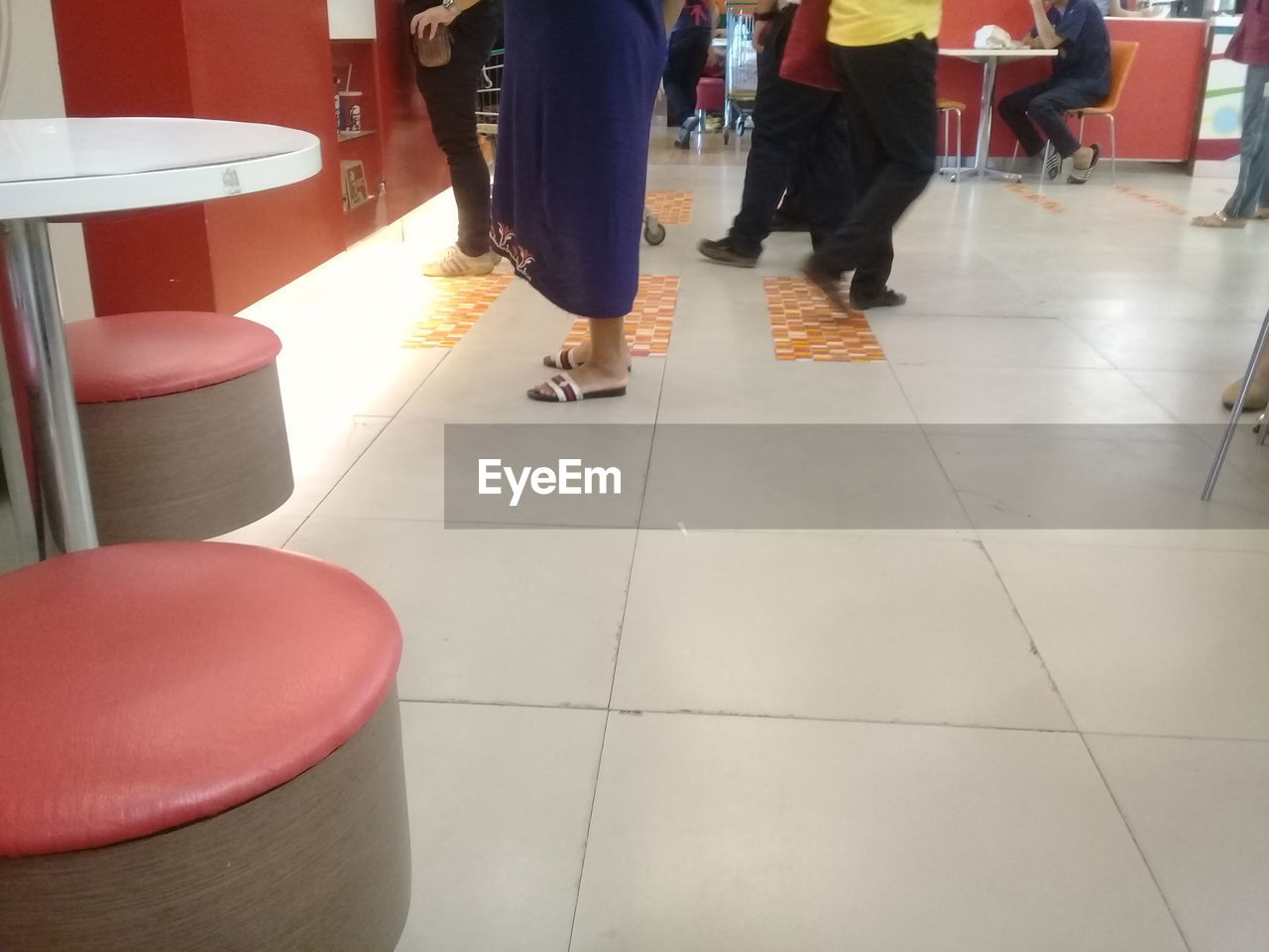 LOW SECTION OF PEOPLE WALKING ON FLOOR