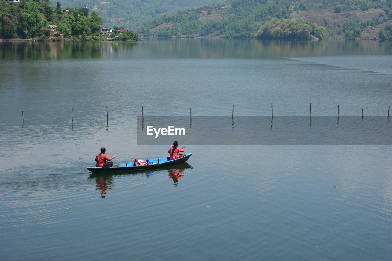 High angle view of women in boat on lake