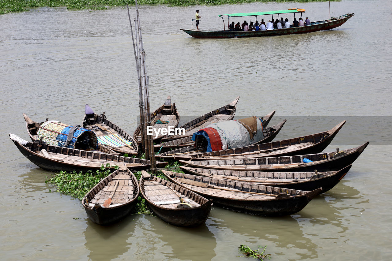 nautical vessel, transportation, water, boat, mode of transportation, vehicle, travel, watercraft, boating, nature, gondola, tradition, day, river, long-tail boat, outdoors, moored, occupation, ship, canoe, tourism, travel destinations, no people