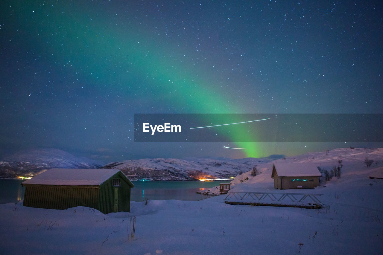 Illuminated house at night during winter