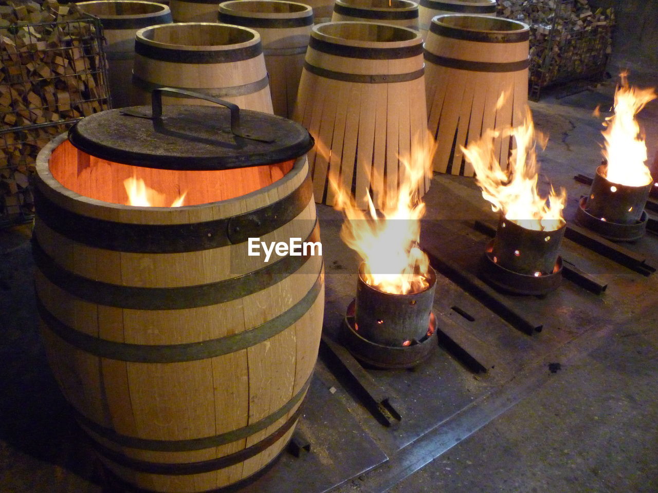 CLOSE-UP OF ILLUMINATED BURNING CANDLES