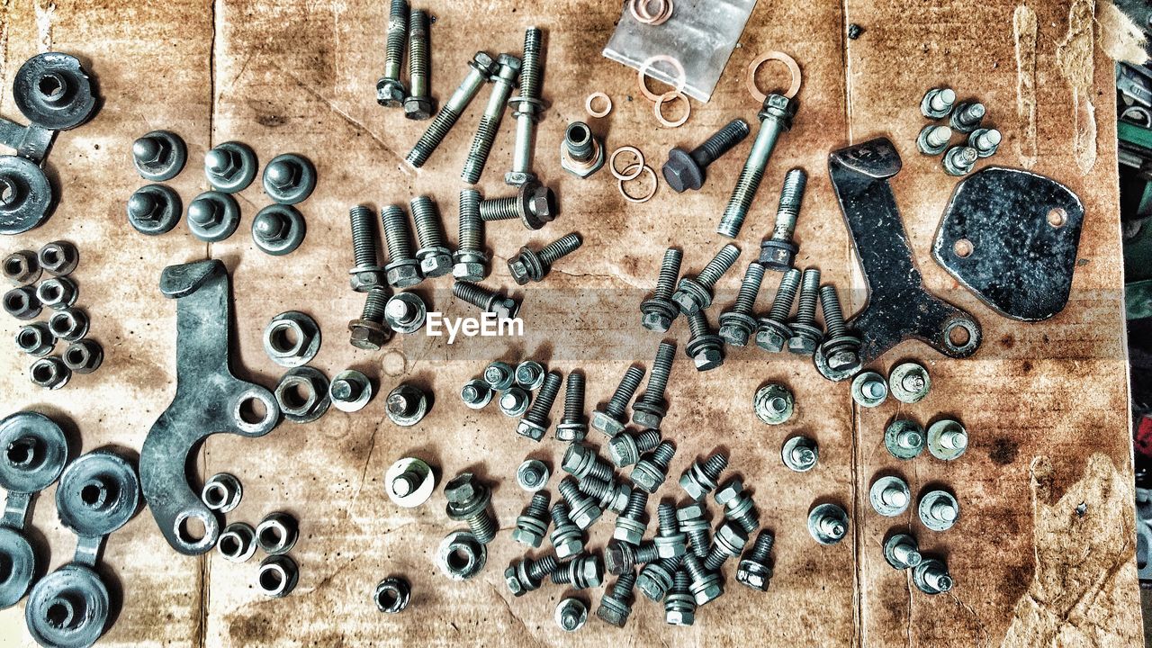 Directly above shot of nuts and nails on table