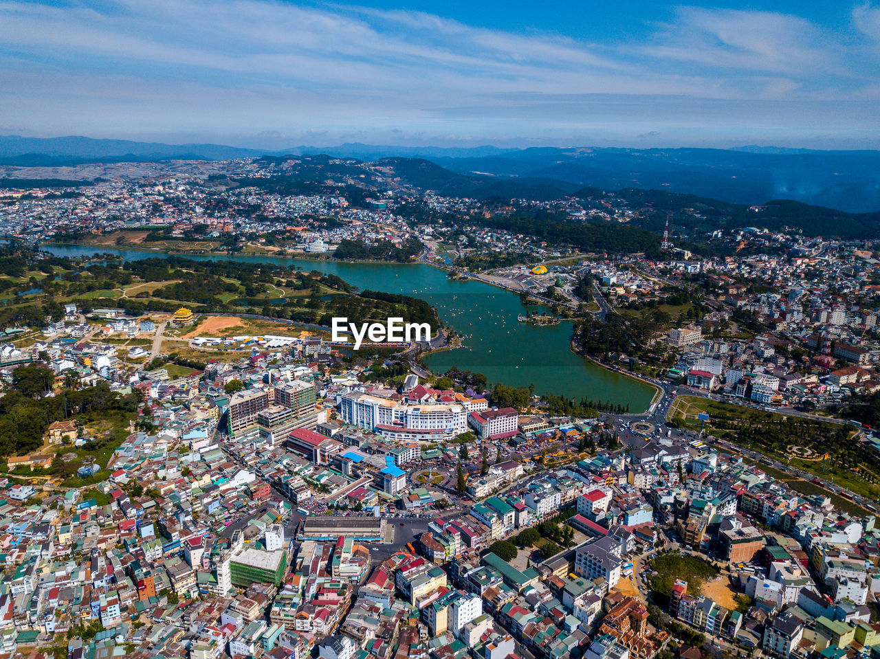 Aerial view of modern buildings in city against sky