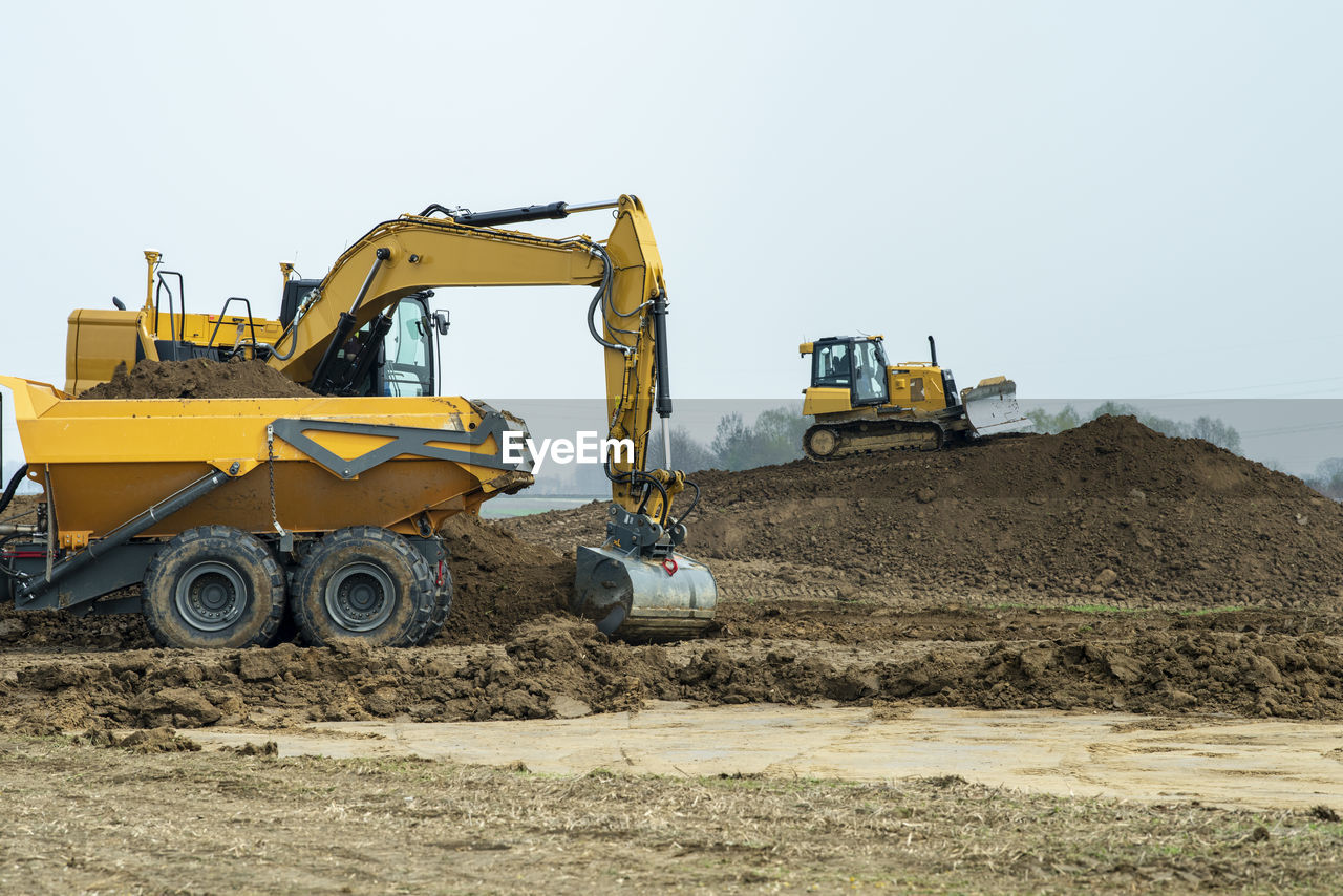 Construction site with digger and truck