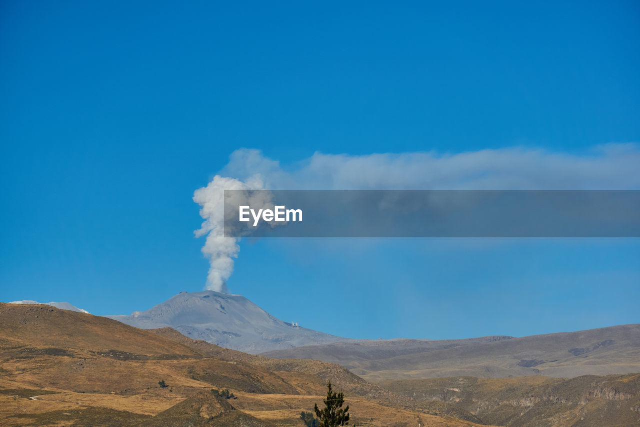 SMOKE EMITTING FROM VOLCANIC MOUNTAIN